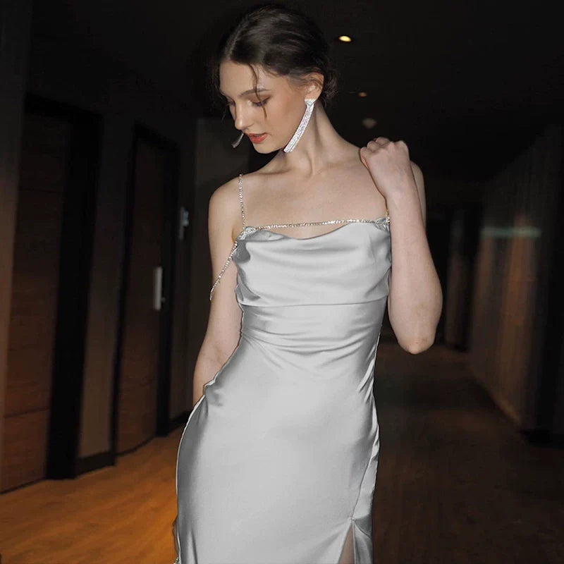 Sexy one-shoulder backless tie-wrapped halter dress with high waistline, showing off the figure, side slit, knee-length long skirt