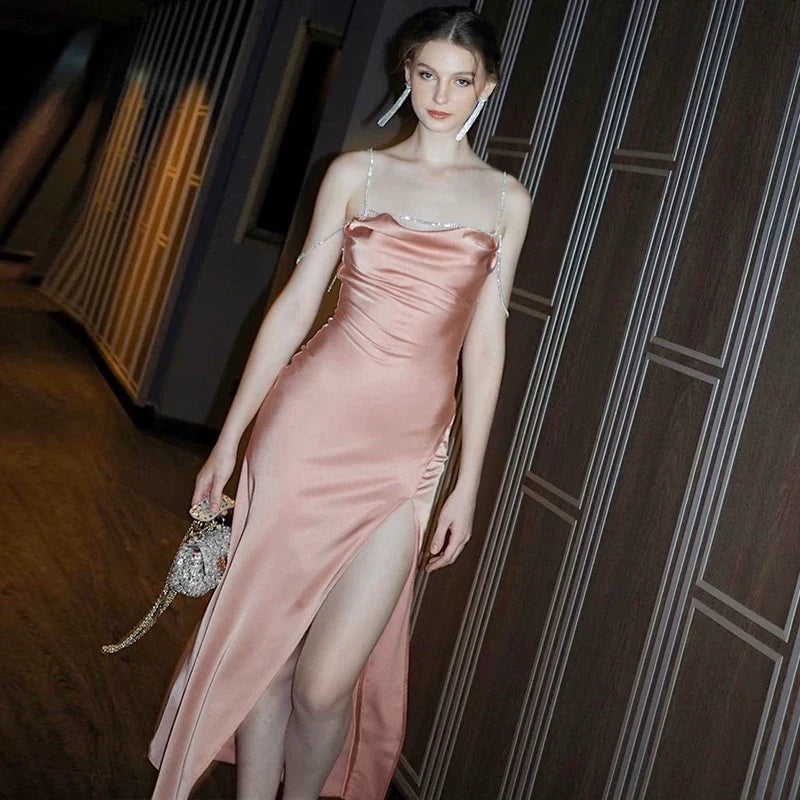 Sexy one-shoulder backless tie-wrapped halter dress with high waistline, showing off the figure, side slit, knee-length long skirt